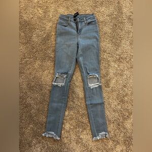 Fashion Nova Light Blue Distressed Skinny Jeans